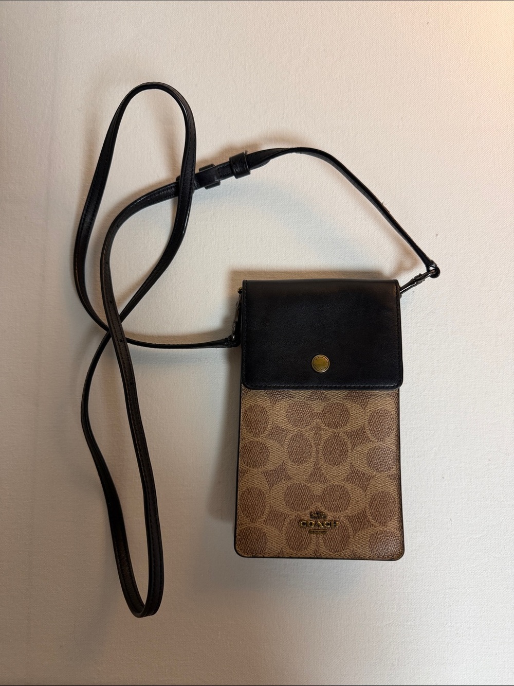 Coach Brown Signature Print and Black Leather Crossbody bag.